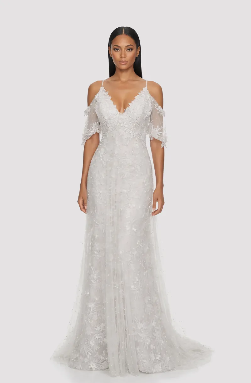 Front view of a woman in an Off-white v-neck off-shoulder lace sleeved mermaid gown with overlay tulle bodice 1, image 1