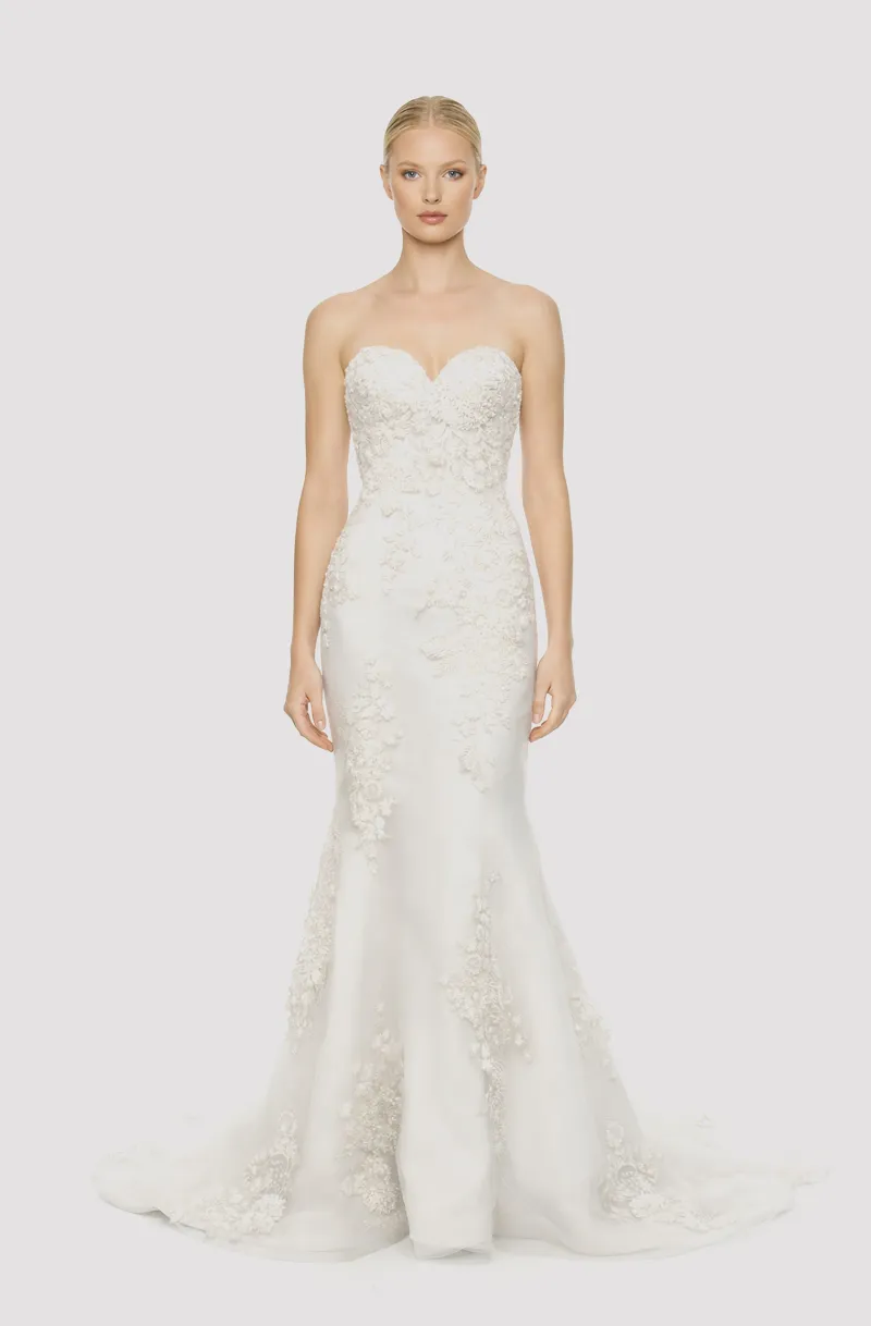 Front view of a woman in an Off-white tulle sweetheart neckline mermaid gown with bodice embellished with hand-beaded lace 10, image 1