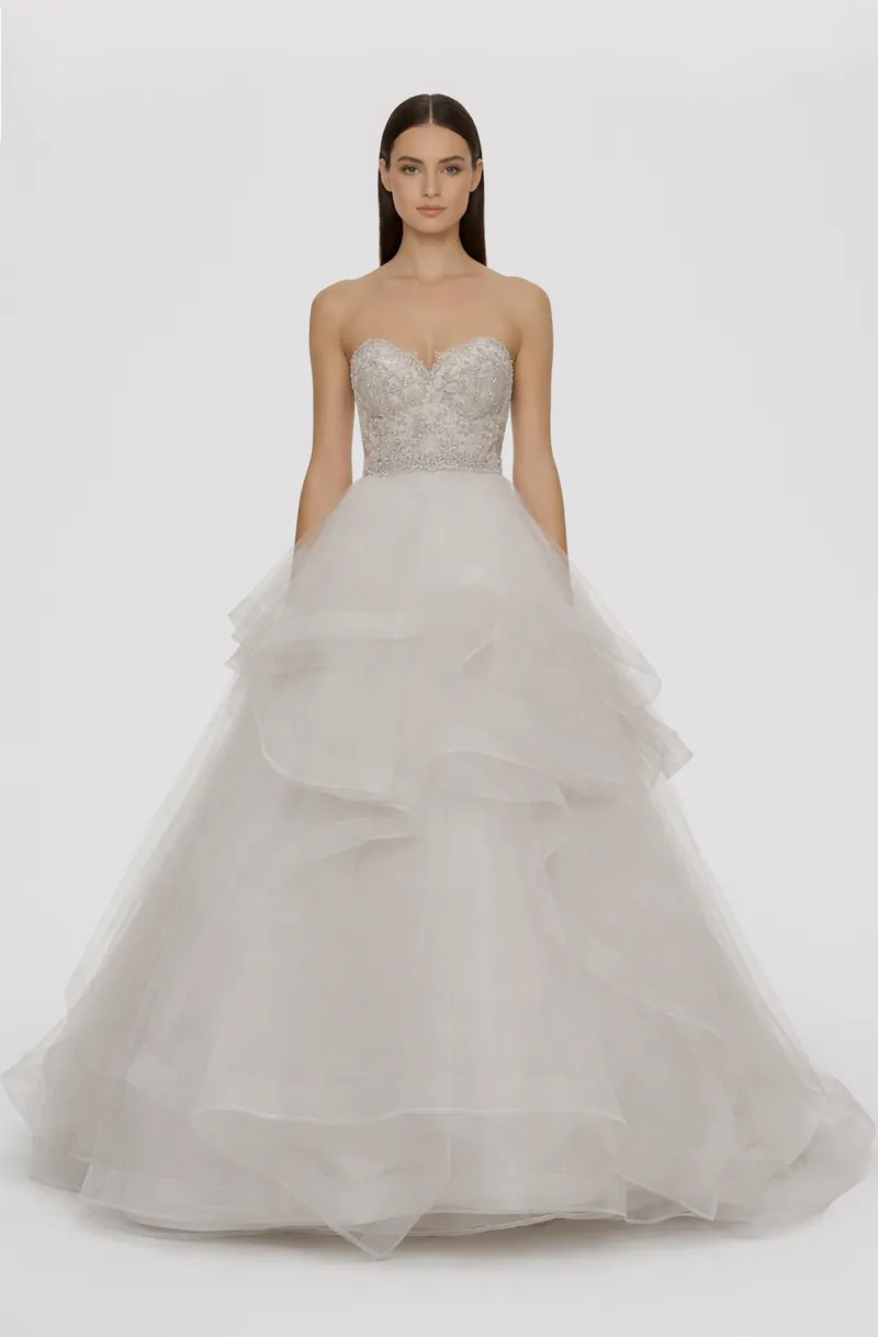 Front view of a woman in an Off-white tulle two-piece ensemble with hand-beaded sweetheart corset and an asymmetrical layered skirt with horsehair 21, image 1