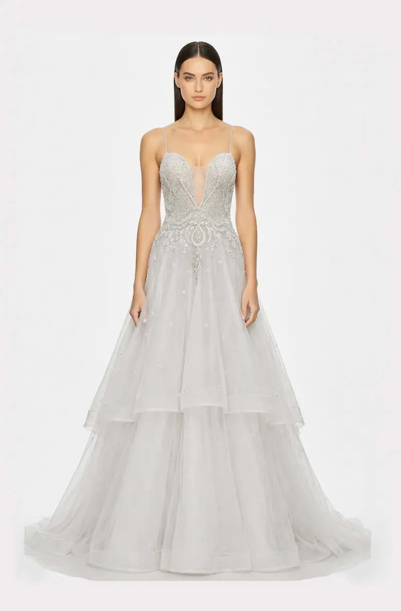 Front view of a woman in an Off-white tulle deep neck ball gown with silver hand-embroidered,  hand-beaded applique 25, image 1
