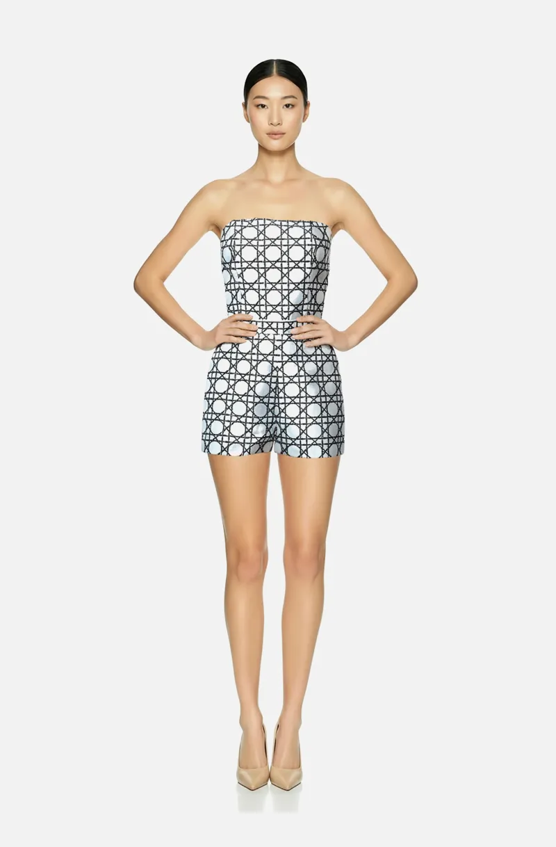 Front view of a woman in an Off-white custom geometric print two-piece ensemble with corseted tube top and micro mini shortsn 54, image 1