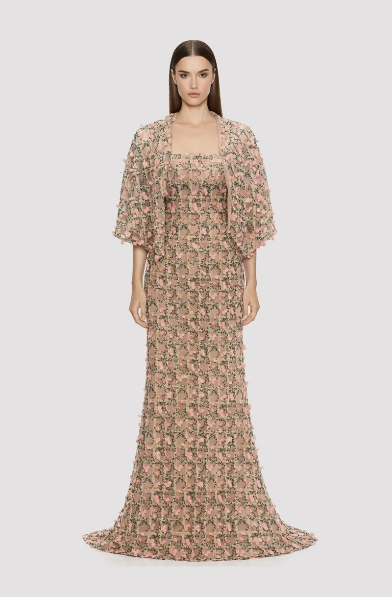 Front view of a woman in a Champagne tulle mermaid gown with pink & green lace with capelet 11, image 1