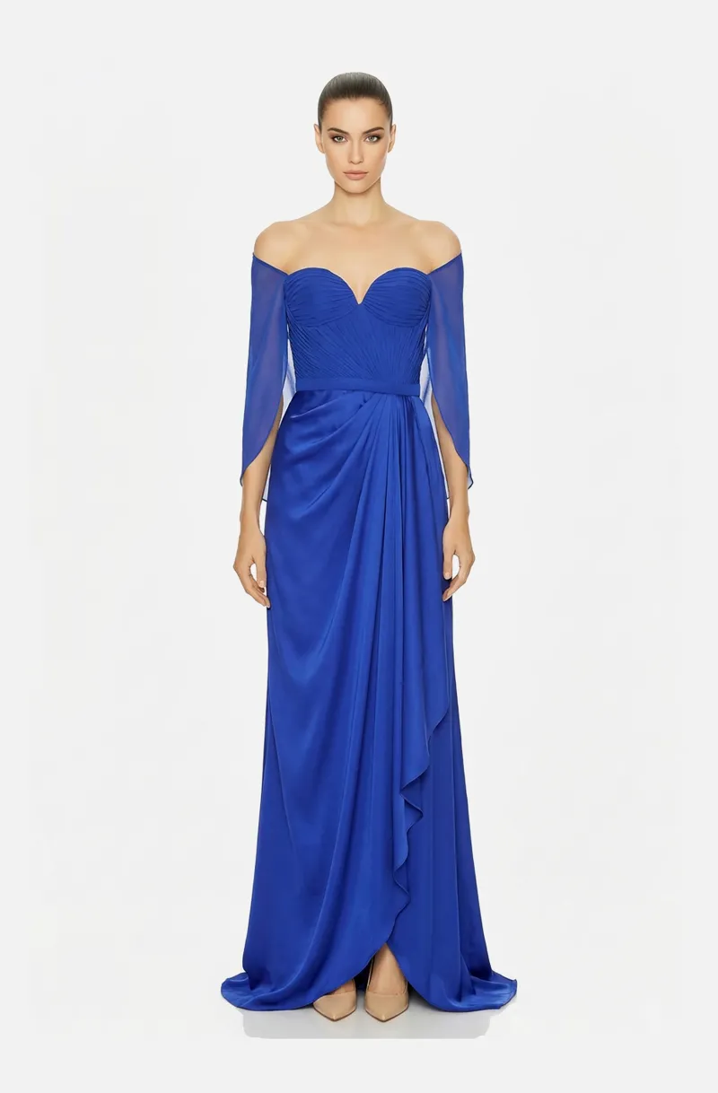 Front view of a woman in a Royal blue draped gown with slit   on the side and off shoulder flowy sleeves 30, image 1