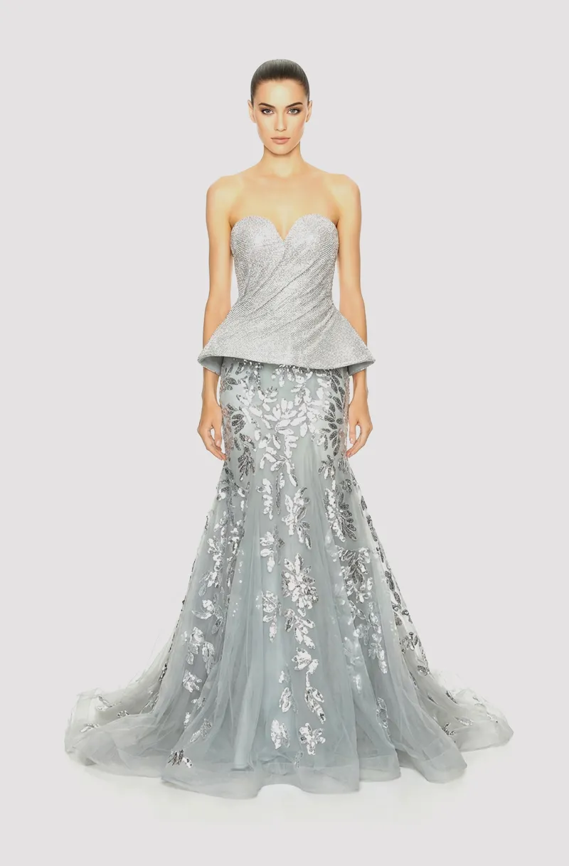 Front view of a woman in aTwo-piece silver ensemble with rhinestone chainmail structured top and a mermaid tulle skirt with silver floral sequin appliqué 39, image 1